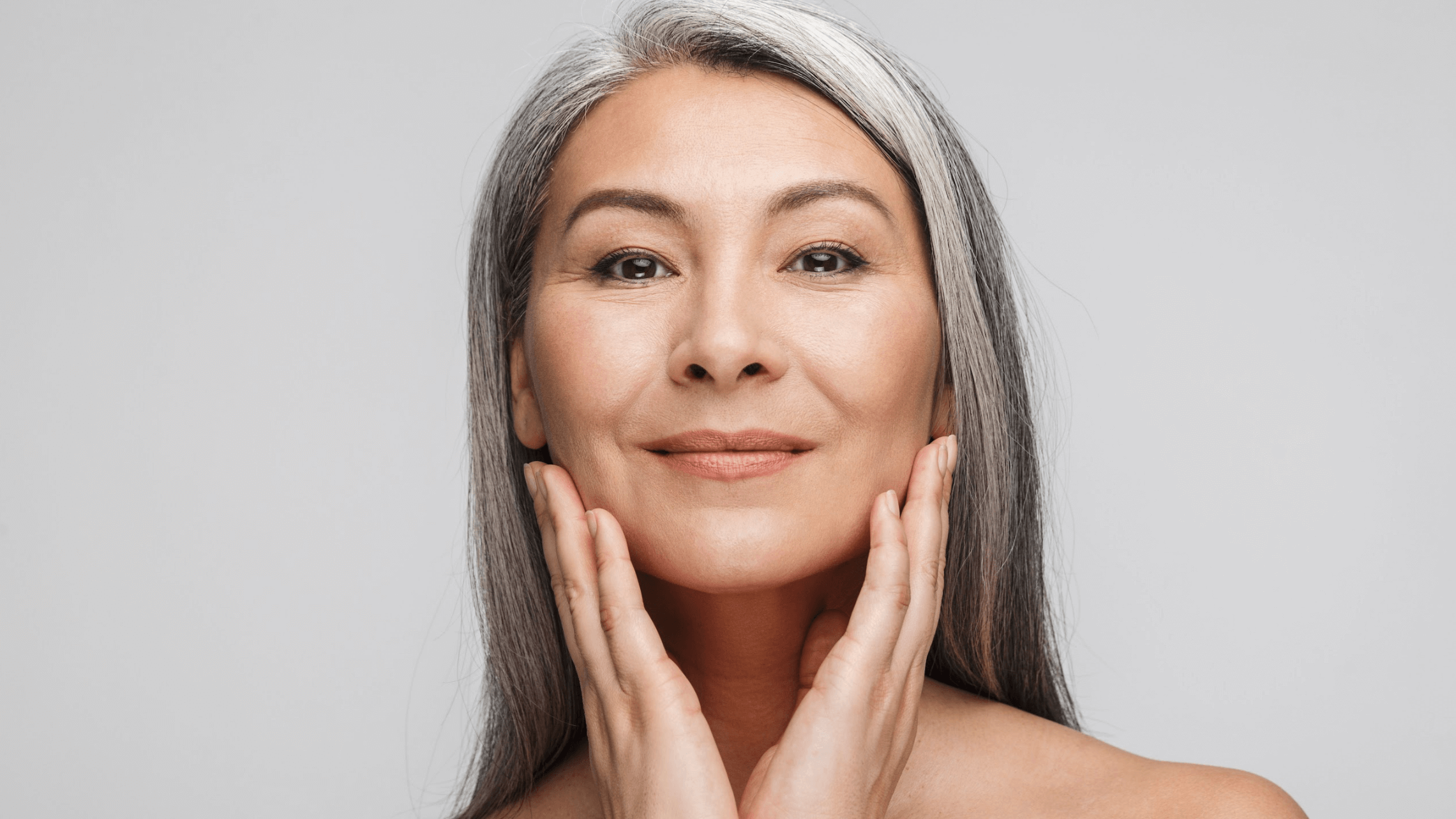woman touching her face